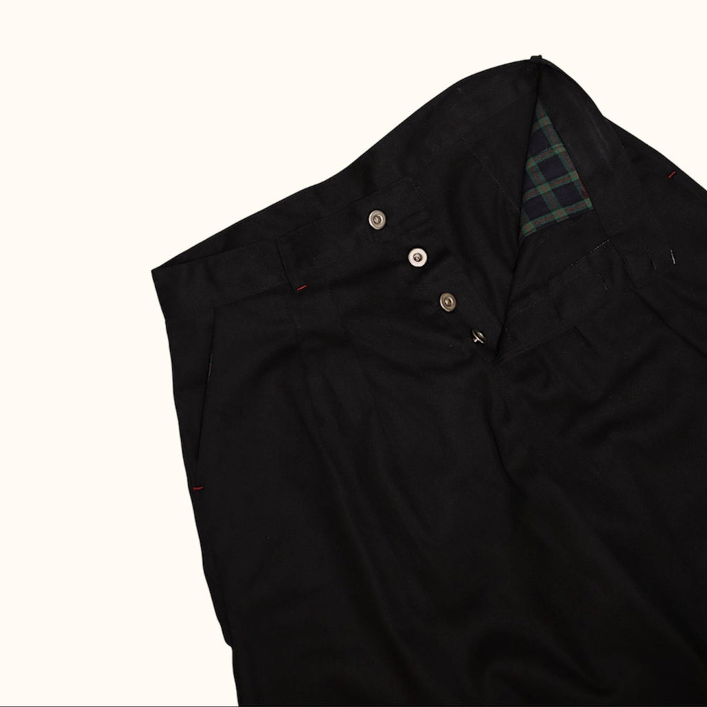 Open flat lay of College Pleated Short showcasing the pocket bag and button closure