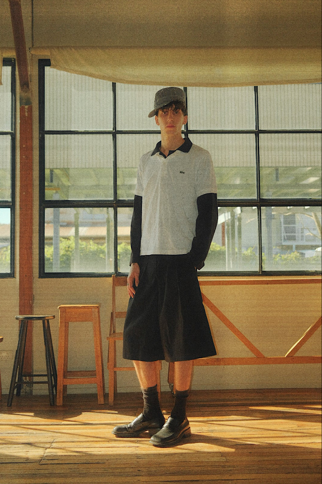 Connor styled in our College Pleated Short