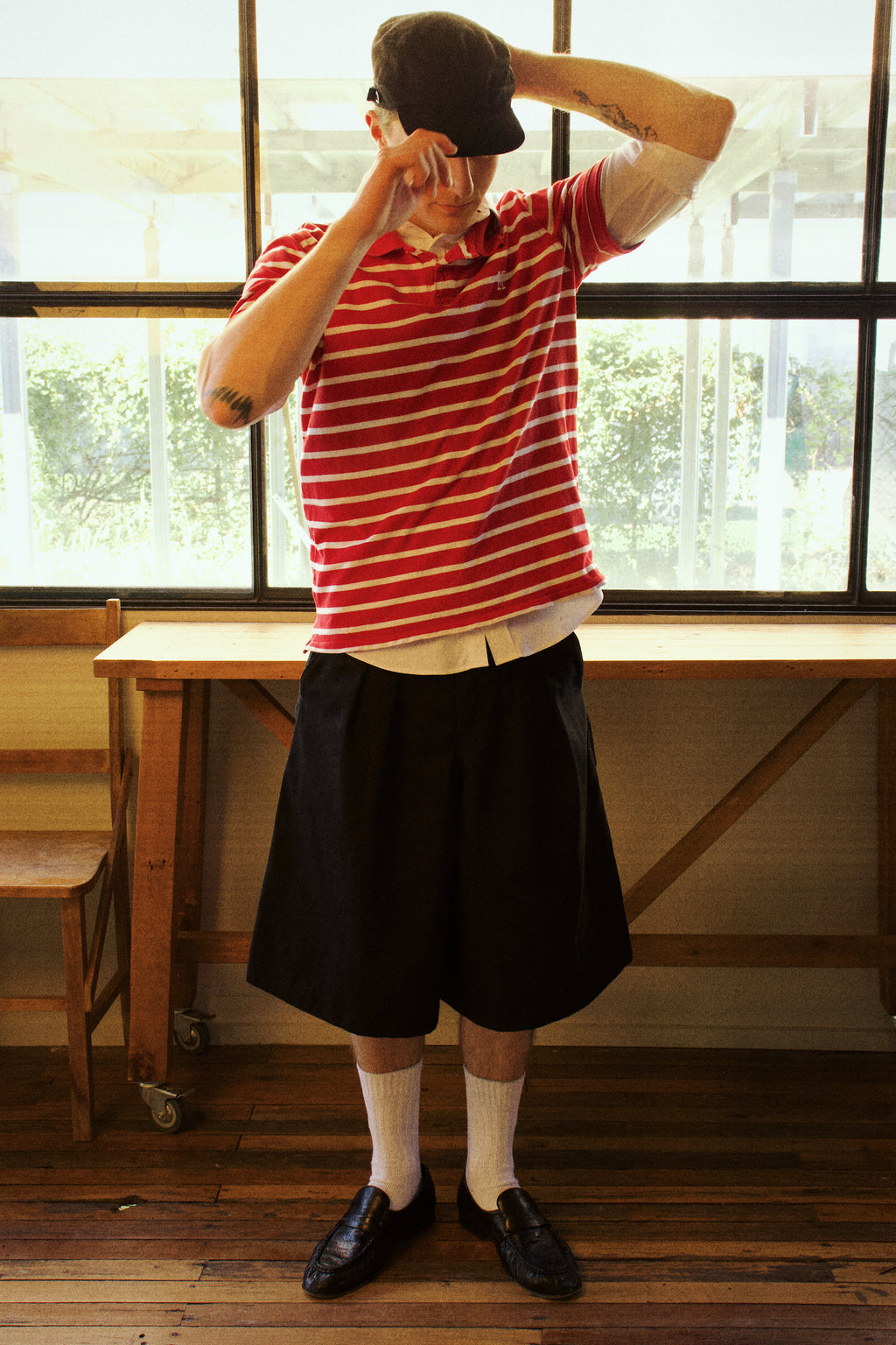 Dylan styled in our College Pleated Shorts