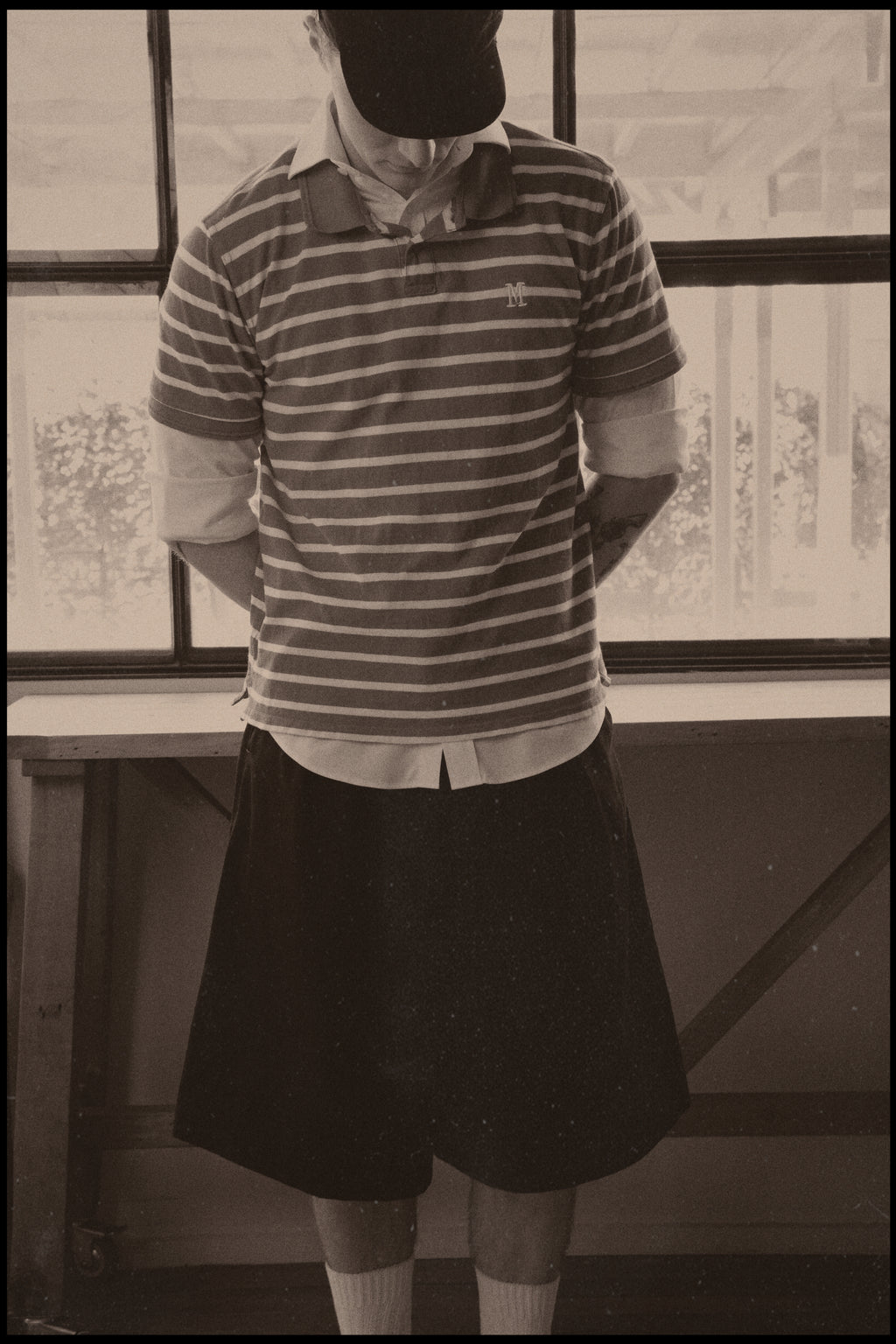 Vintage photo of Dylan styled in our College Pleated Short