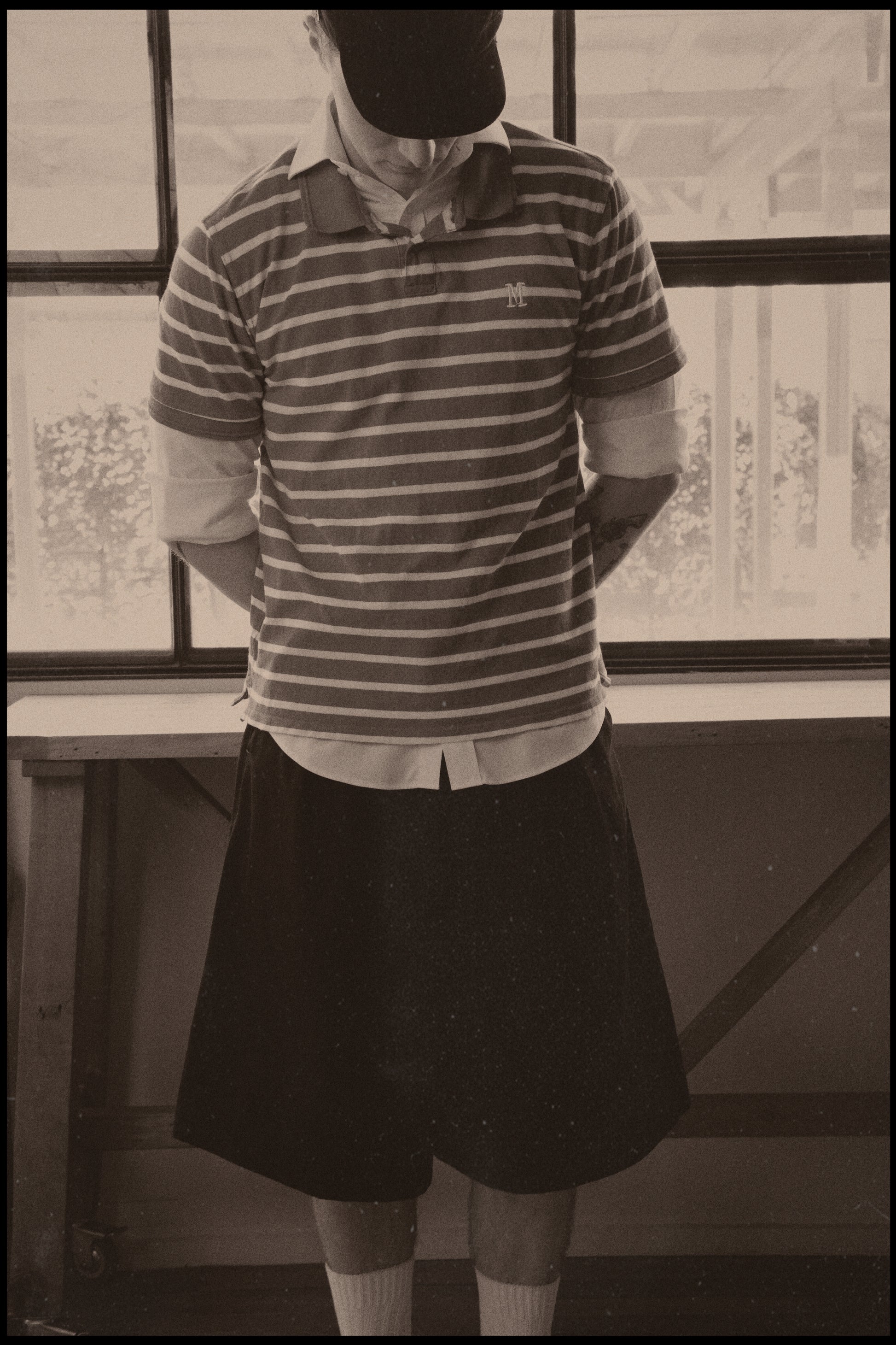 Vintage photo of Dylan styled in our College Pleated Short