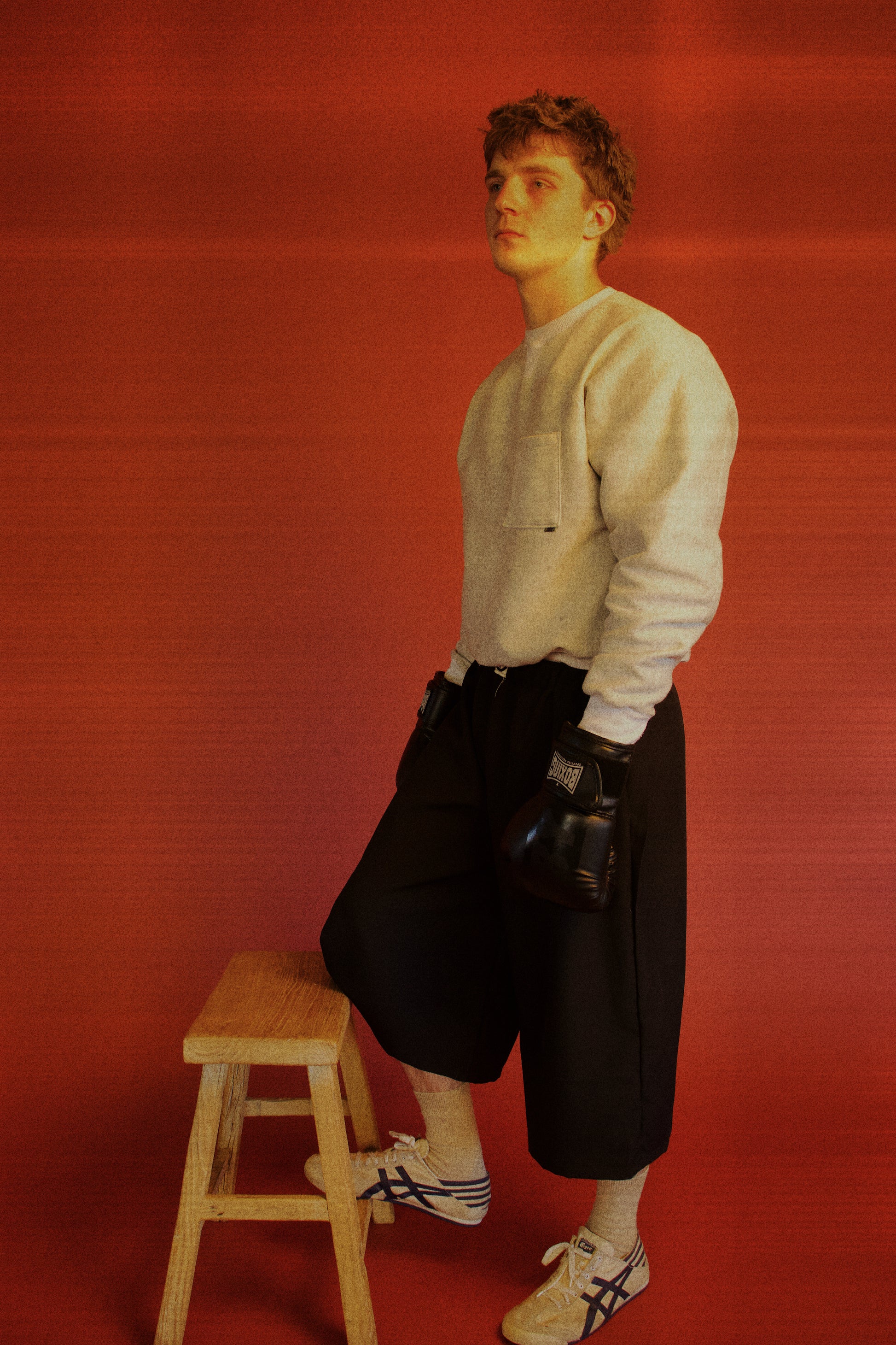 Dylan styled in our Pocket Sweatshirt with a boxing/sportswear aesthetic