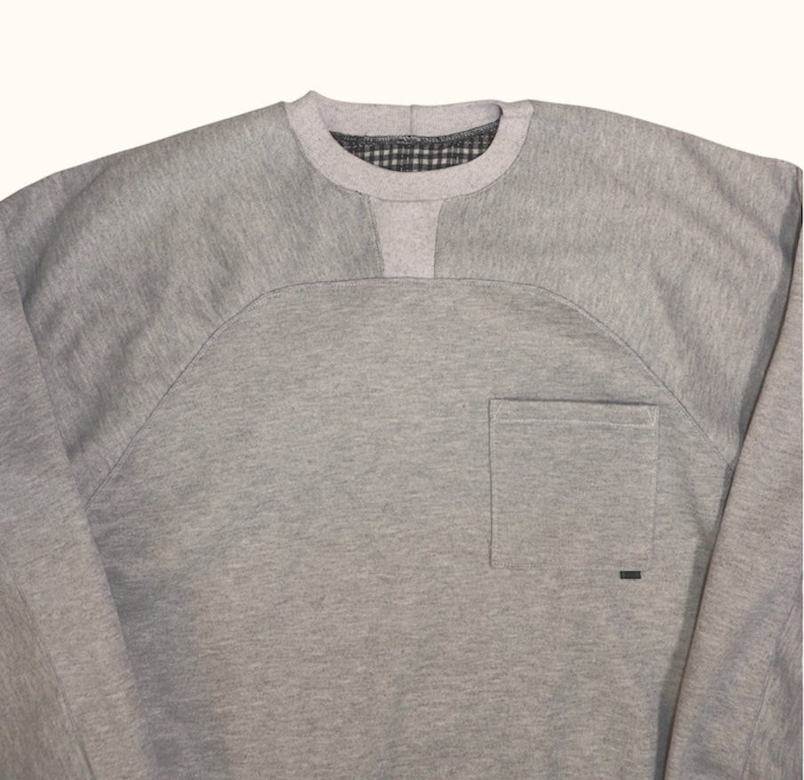 Close up flat lay of our Pocket Sweatshirt showcasing yoke, contrast ribbing and front pocket