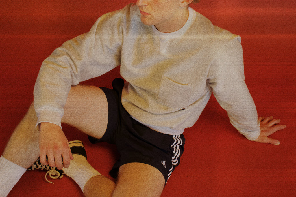 Dylan styled in our Pocket Sweatshirt with a boxing/sportswear aesthetic