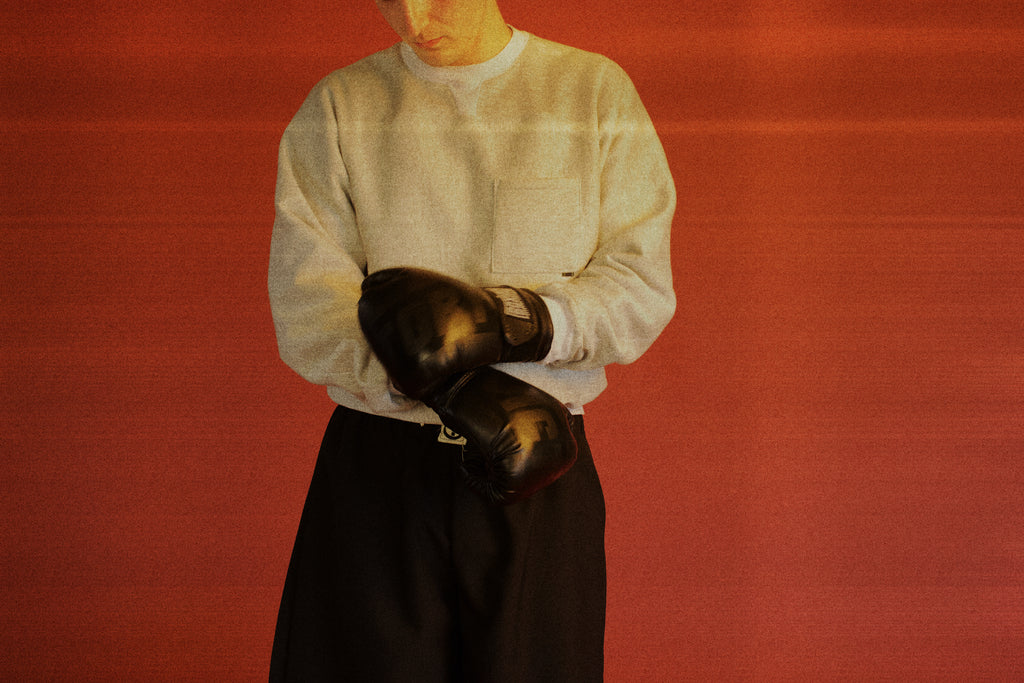 Dylan styled in our Pocket Sweatshirt with a boxing/sportswear aesthetic