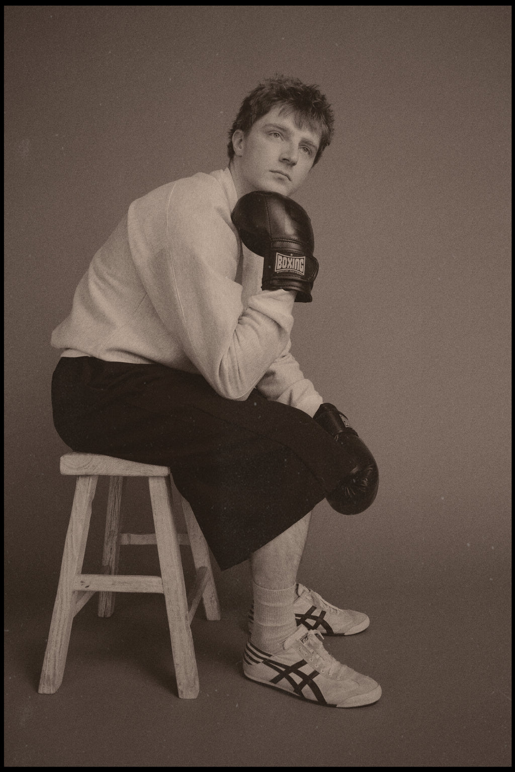 Dylan styled in our Pocket Sweatshirt with a boxing/sportswear aesthetic