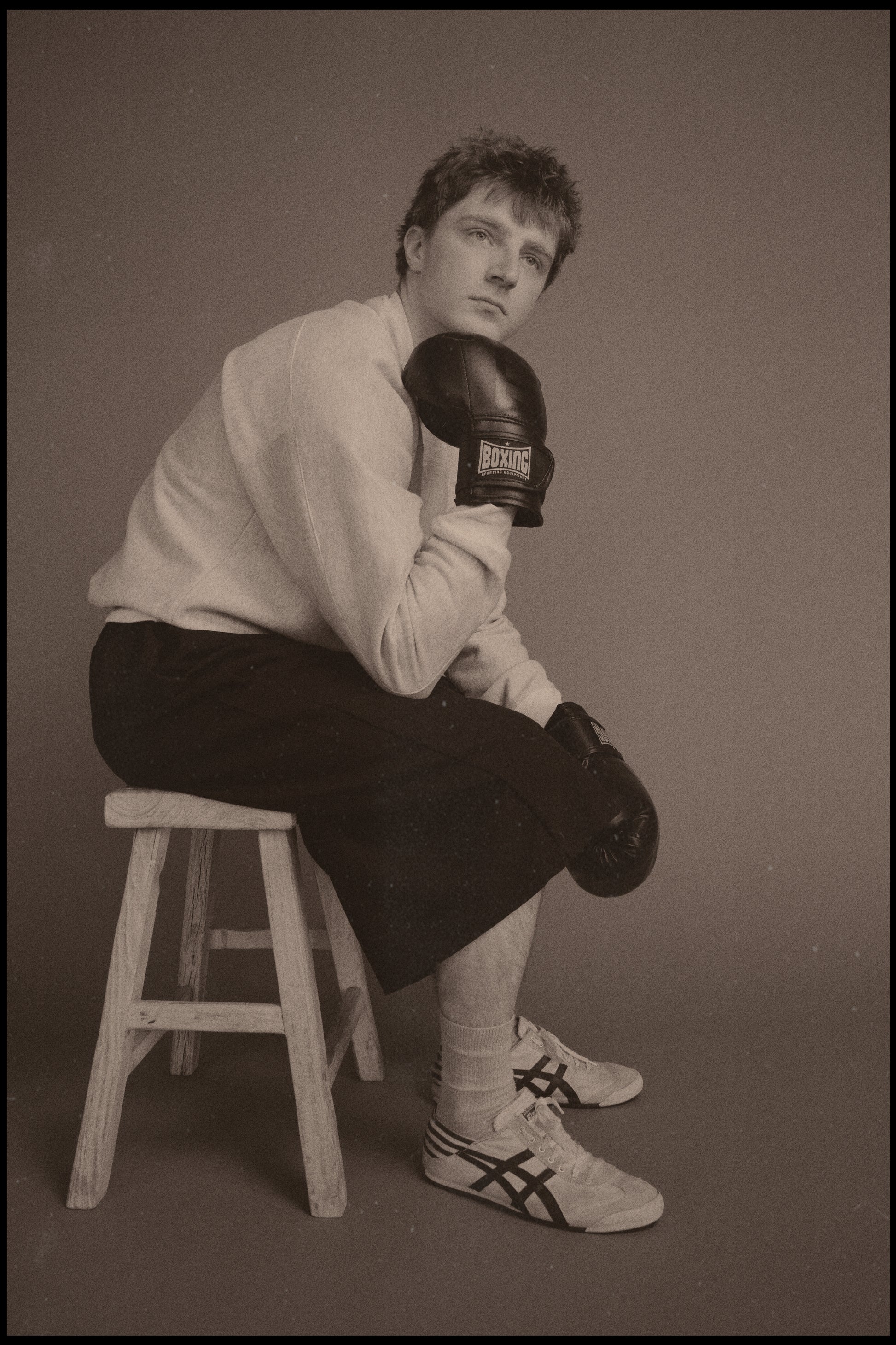 Dylan styled in our Pocket Sweatshirt with a boxing/sportswear aesthetic