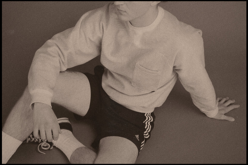 Dylan styled in our Pocket Sweatshirt with a boxing/sportswear aesthetic