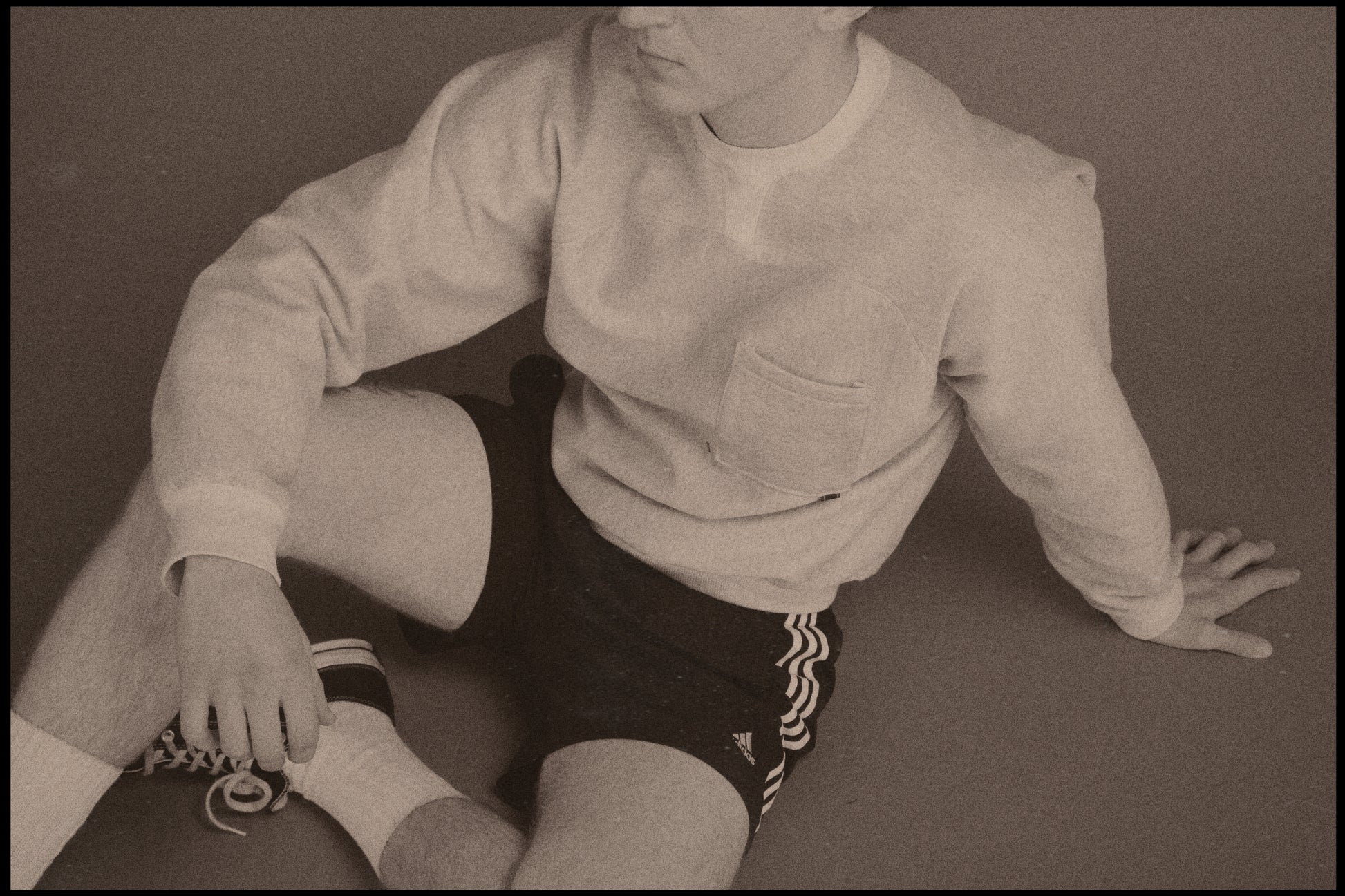 Dylan styled in our Pocket Sweatshirt with a boxing/sportswear aesthetic