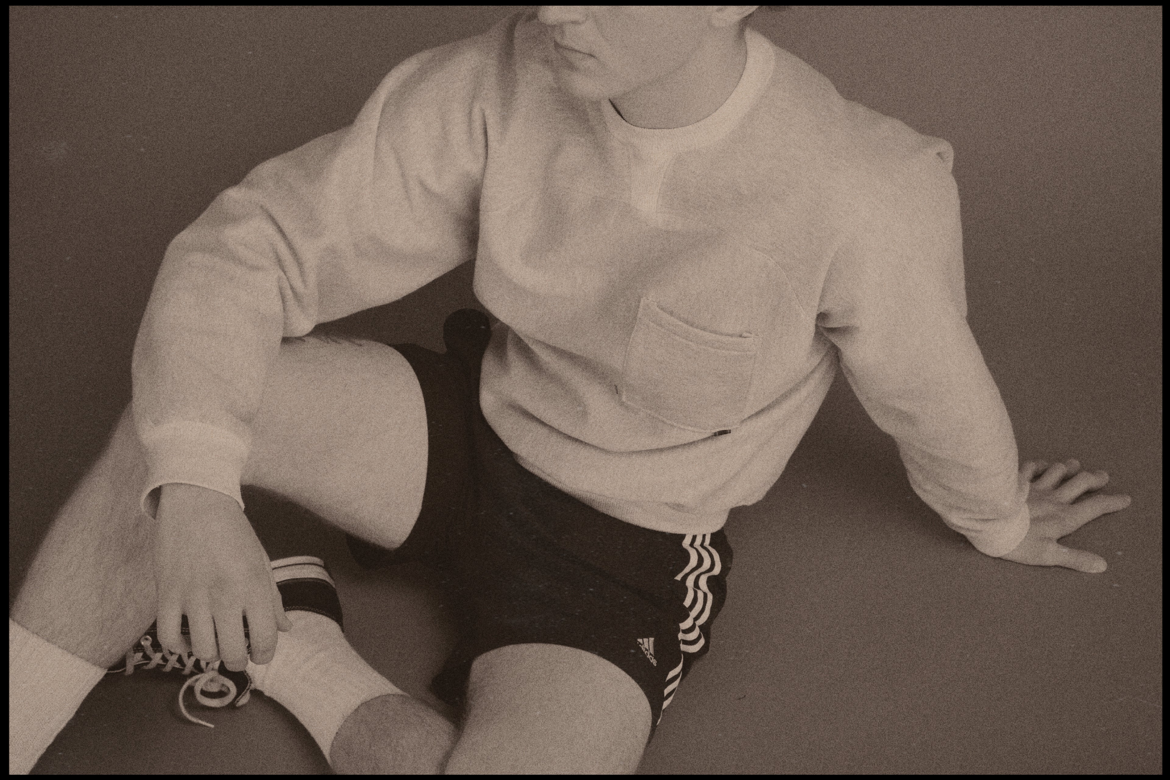 Dylan styled in our Pocket Sweatshirt with a boxing/sportswear aesthetic