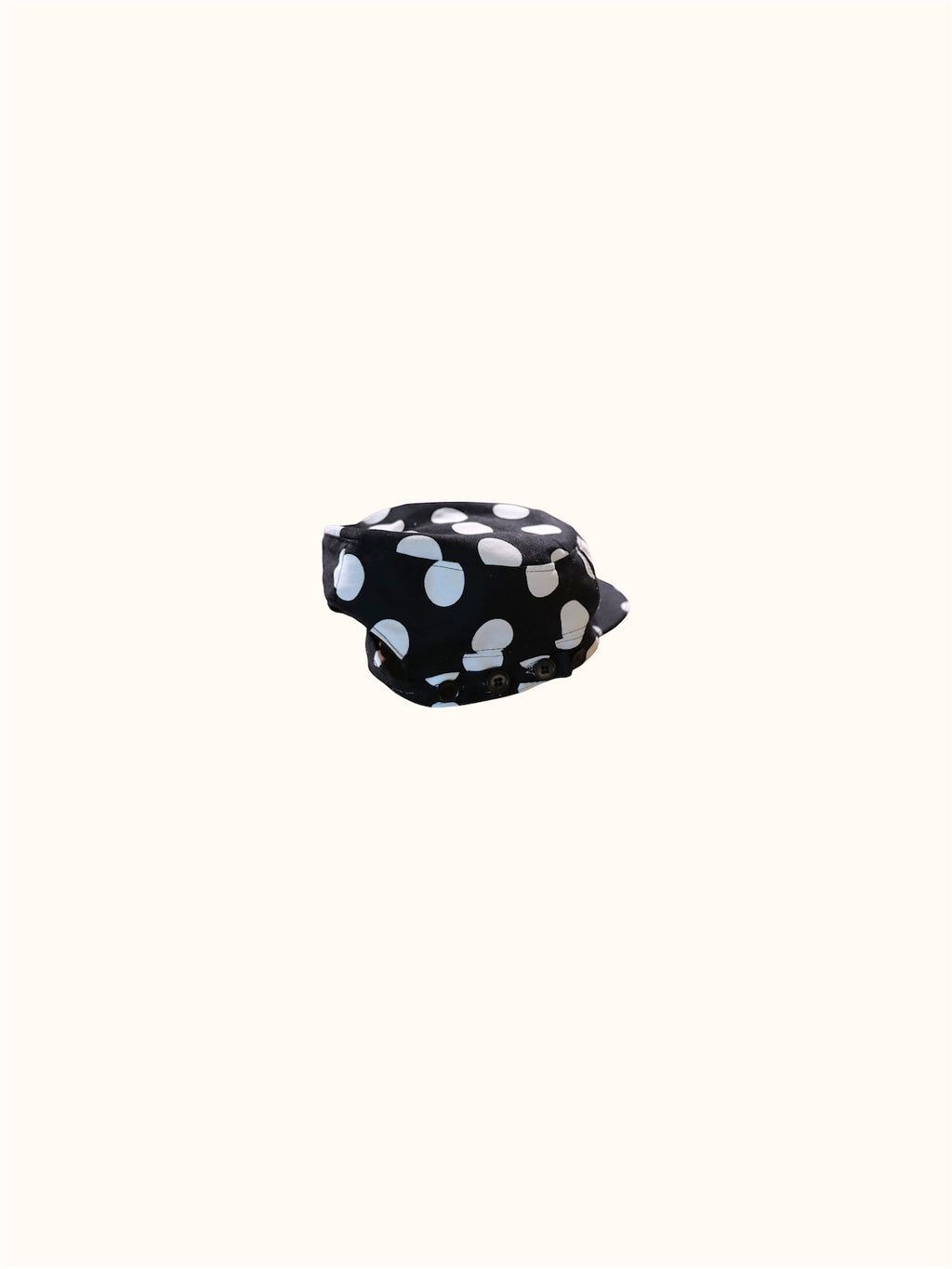 Flat lay showcasing button closure strap