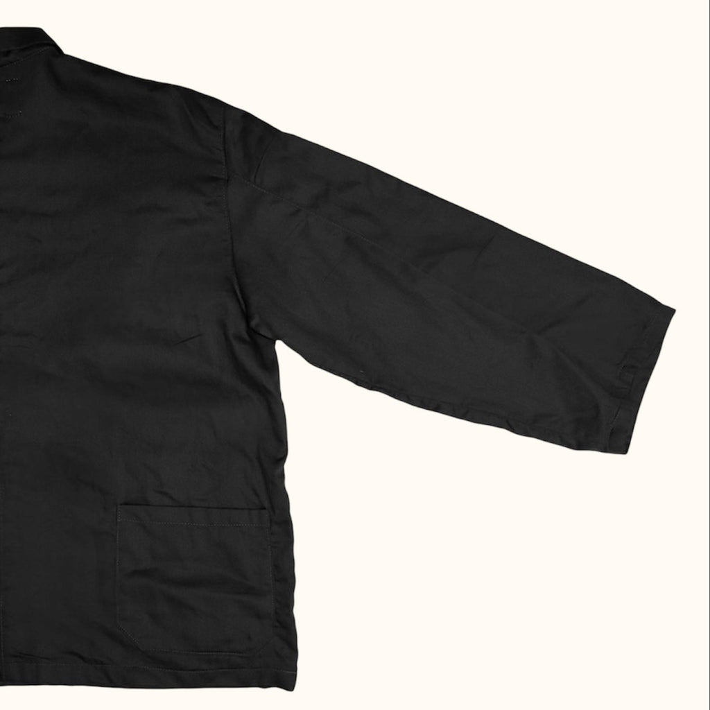 Close up flat lay of Black Fisherman Smock