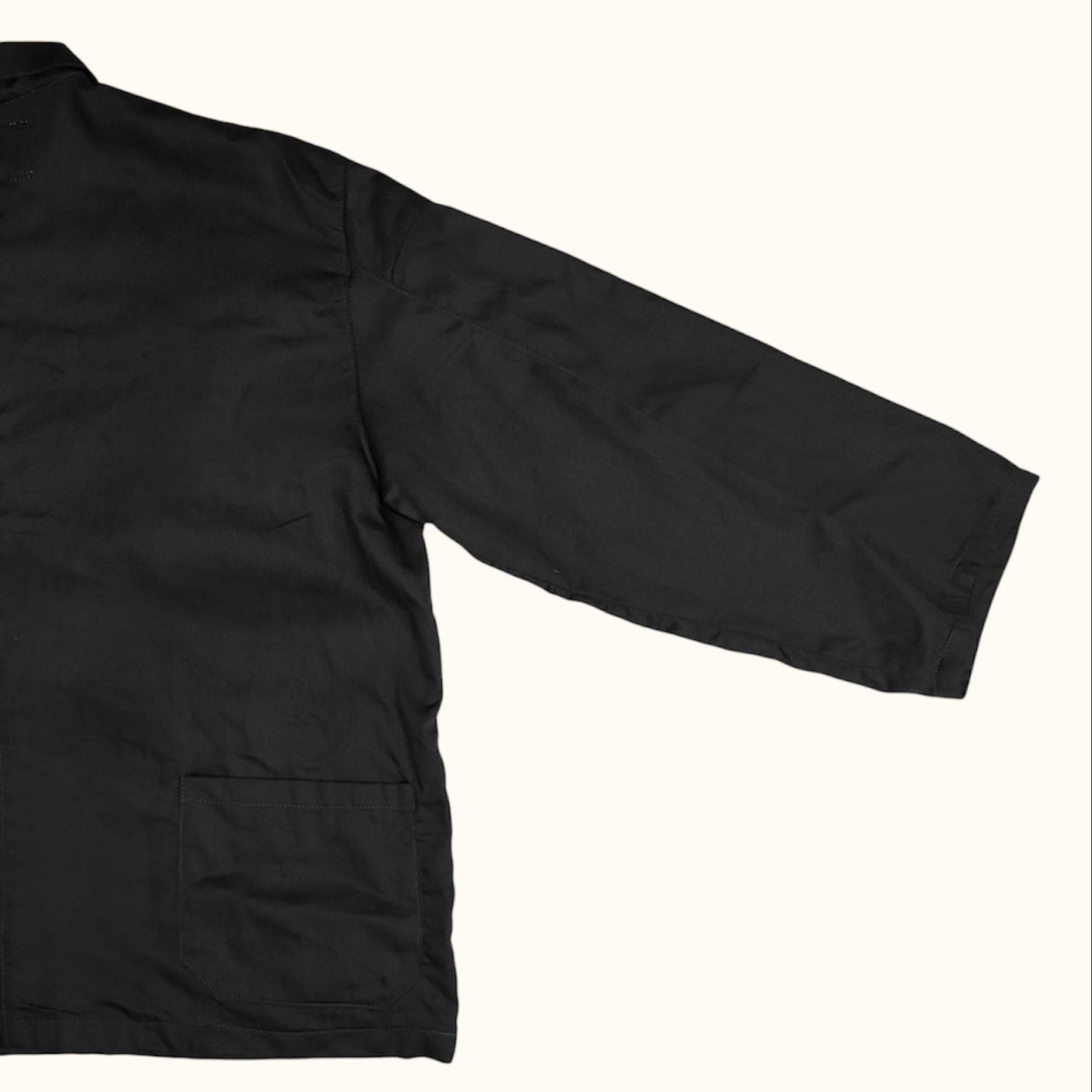 Close up flat lay of Black Fisherman Smock