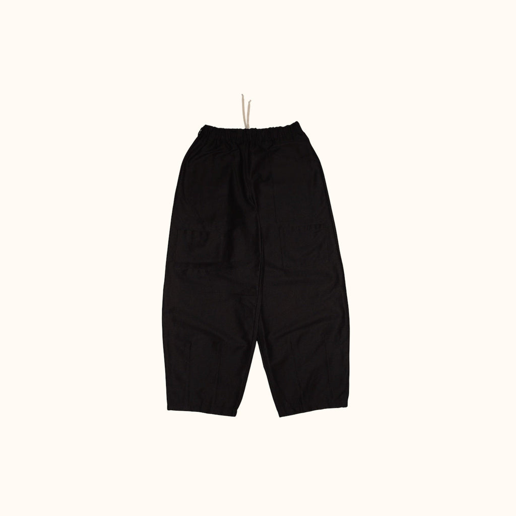Front flay lay of our Studio Pants. Highlighting the four front patch pockets, elastic waistband and balloon shape.