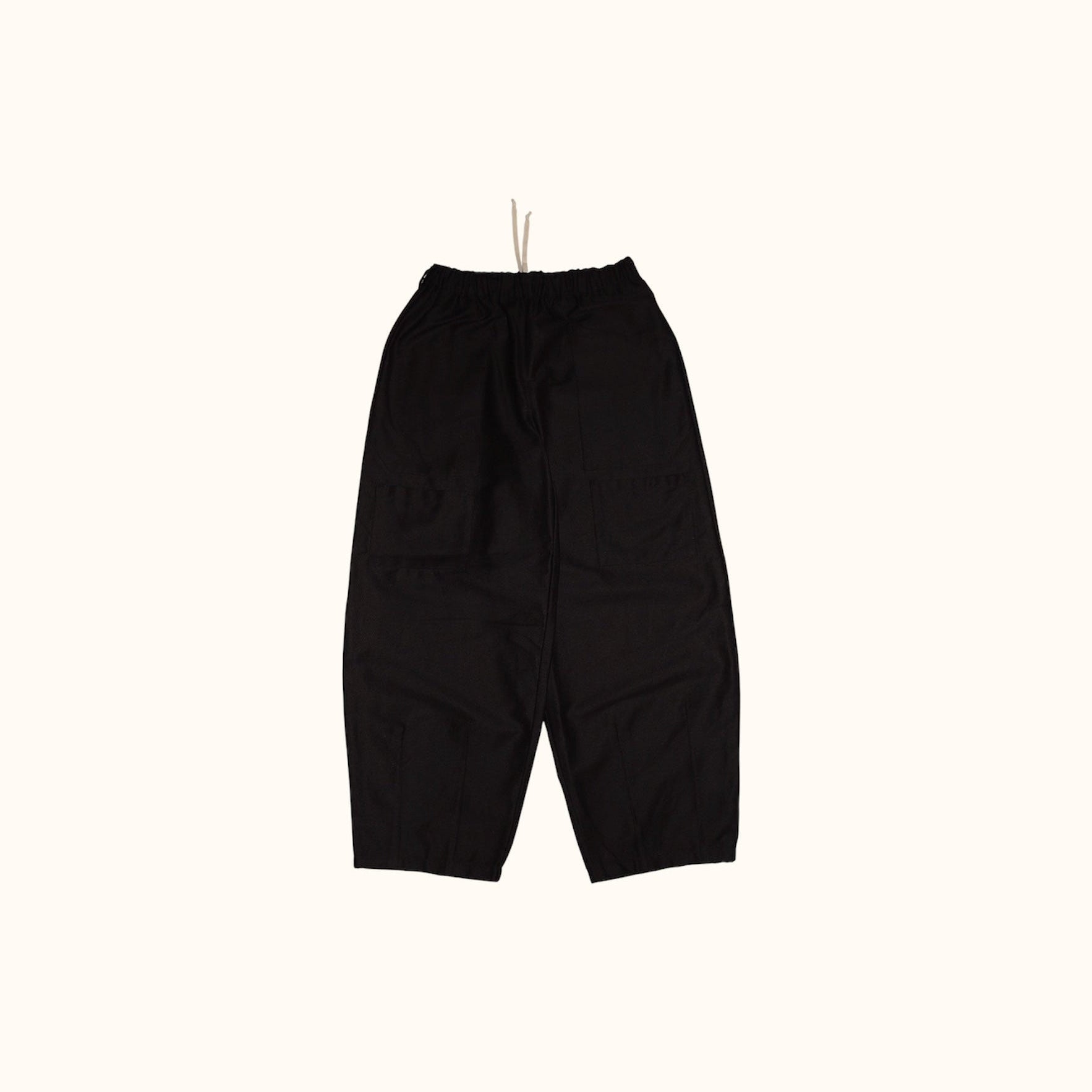 Front flay lay of our Studio Pants. Highlighting the four front patch pockets, elastic waistband and balloon shape.
