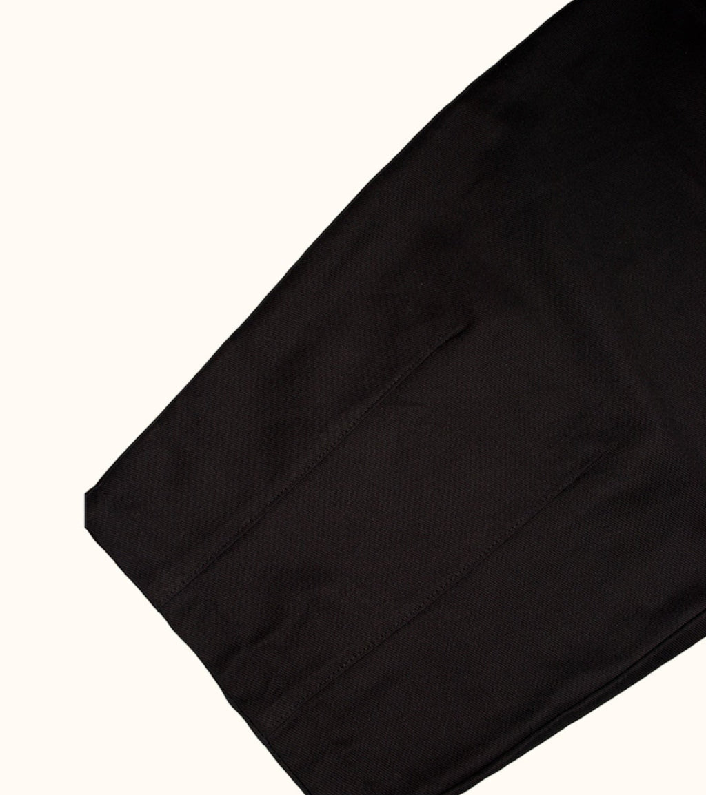 Close up showcasing darts at the hem of our Studio Pants