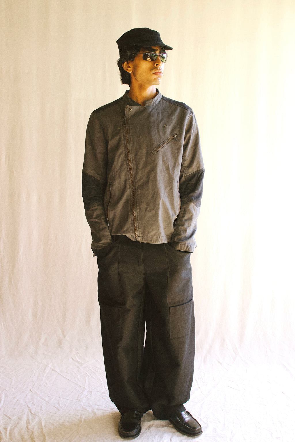 Close up of studio pants in soft lghting, to showcase front details and overall fit